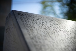 Close-up of a personalized QR memorial marker with engraved details.