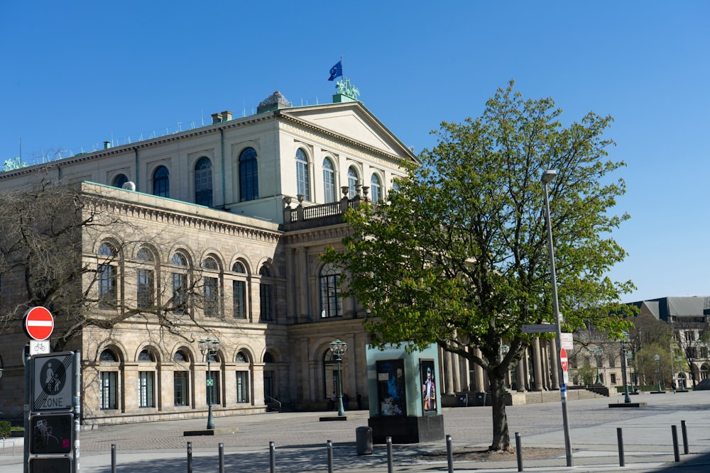 a large building with a tree in front of it