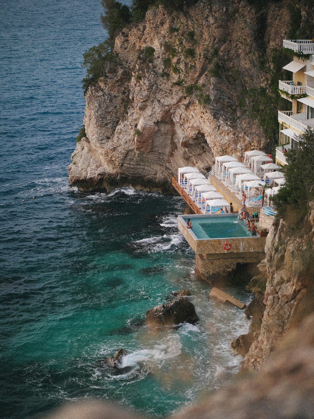 an aerial view of a resort with a swimming pool