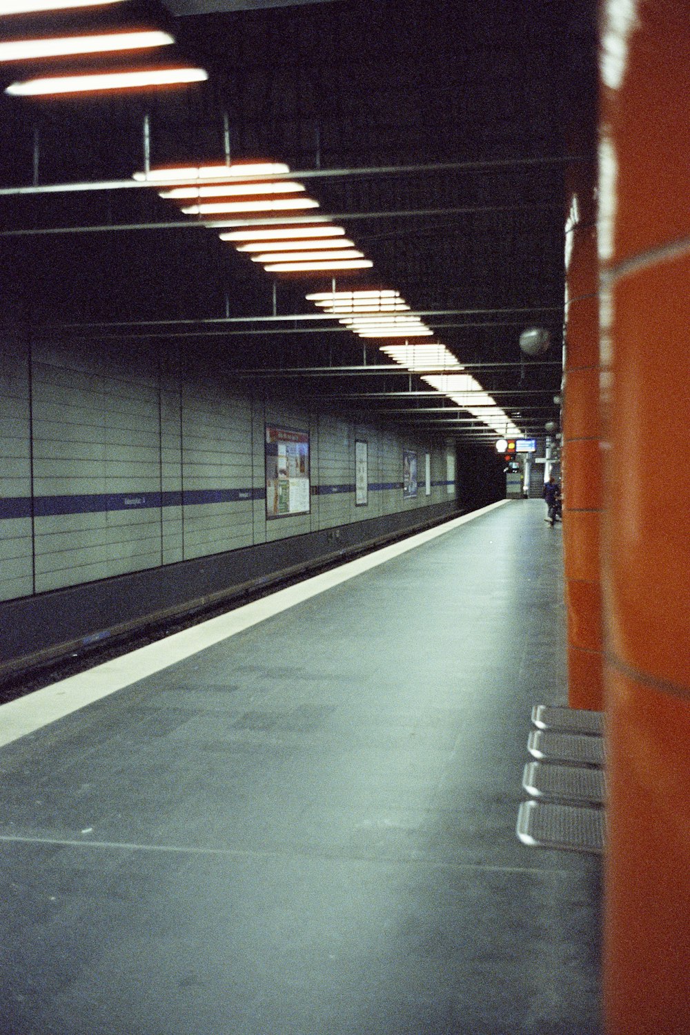 a train station with a train pulling into the station