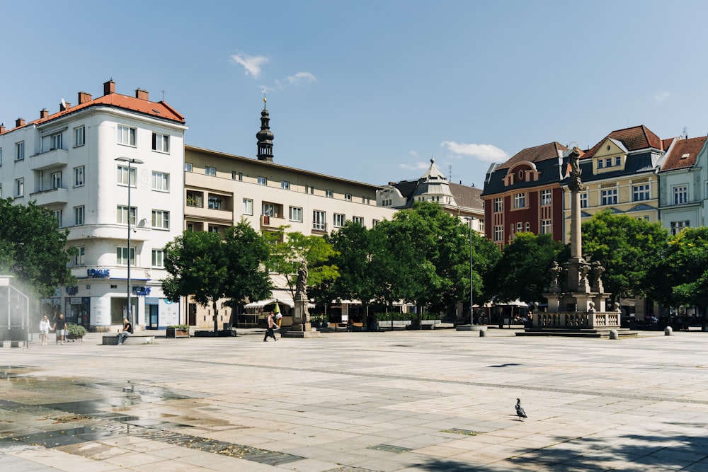 a city square with a fountain in the middle of it