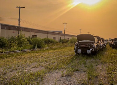 A row of trucks with freshly replaced windshields parked outside the Brunswick Glass Repair facility.