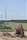 A construction site showcasing a windmill under construction.