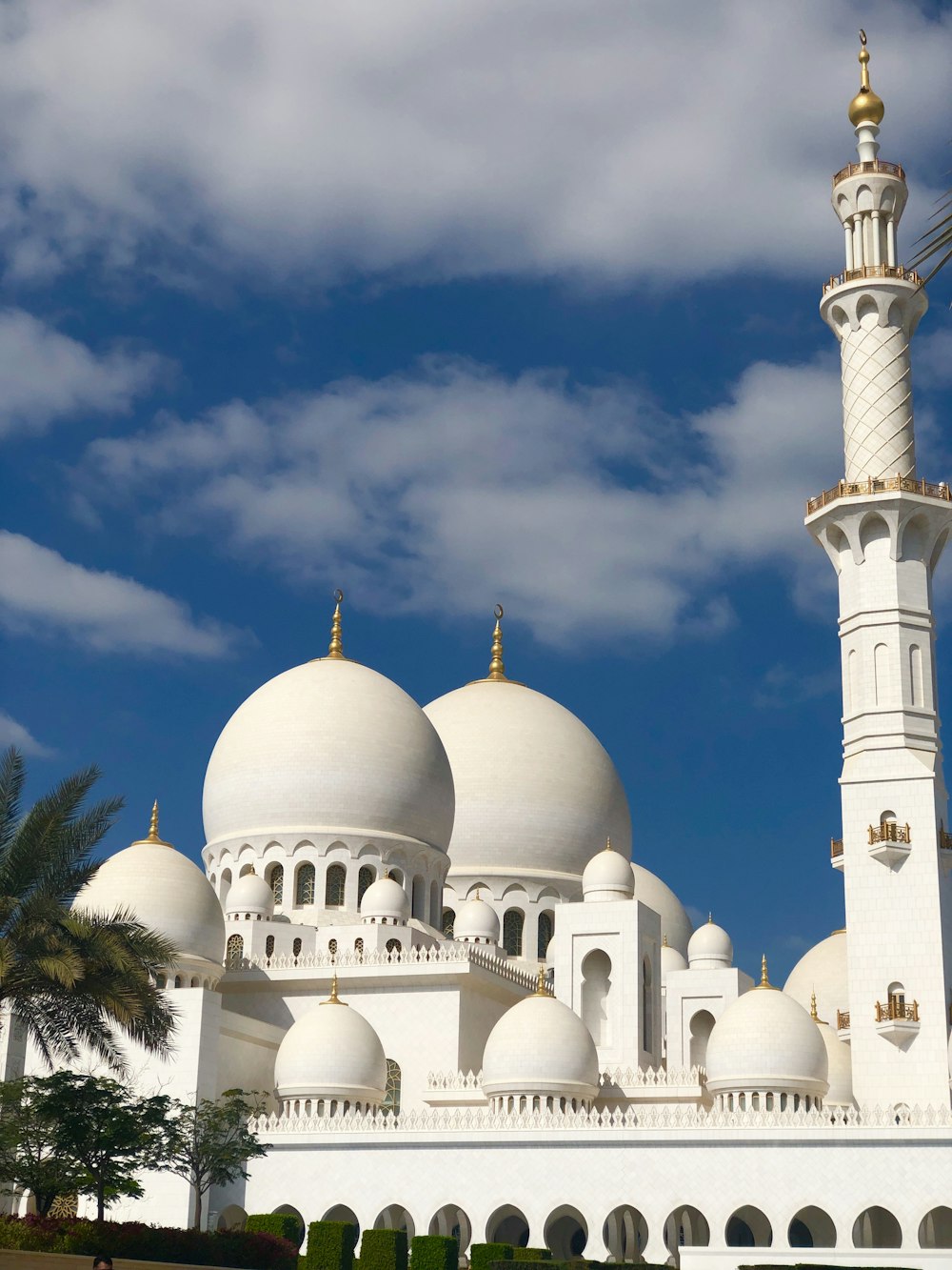 a large white building with a tall white tower