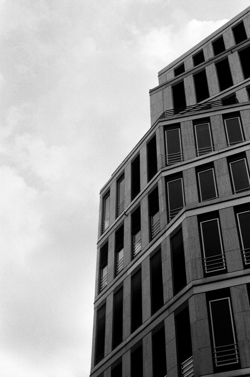 a black and white photo of a tall building