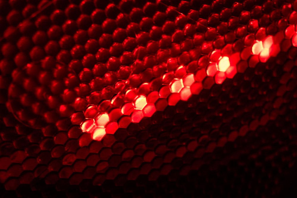 a close up of a red light in the dark