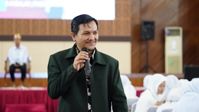 a man standing in front of a microphone