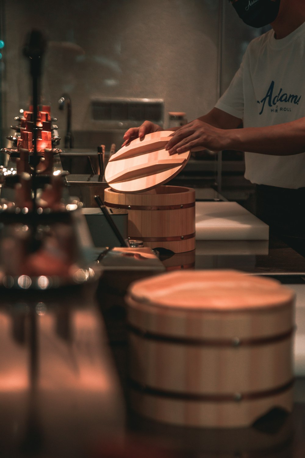 a person in a kitchen preparing food on a stove