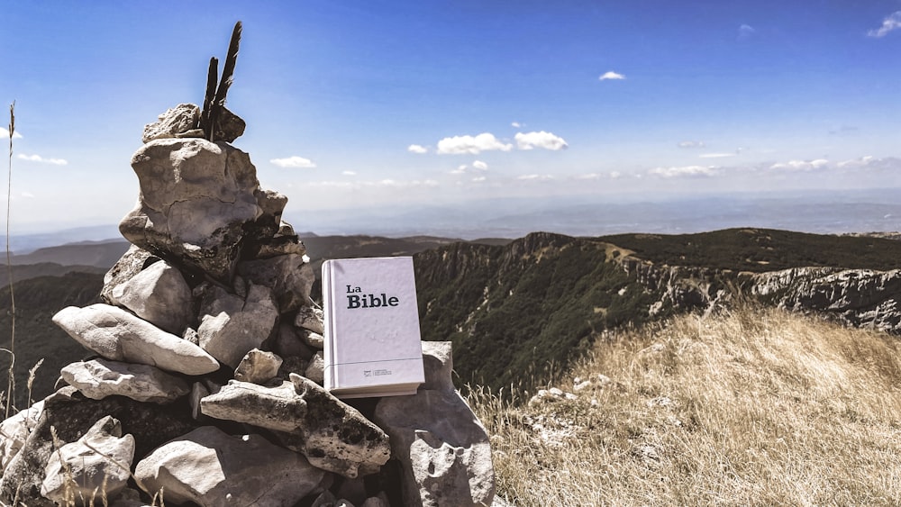 a book sitting on top of a pile of rocks