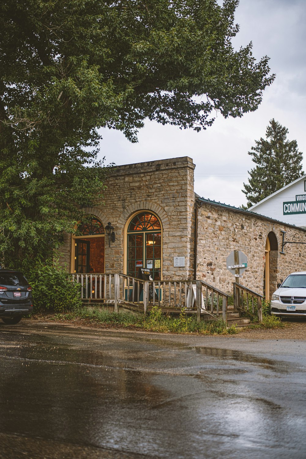 a car parked in front of a stone building