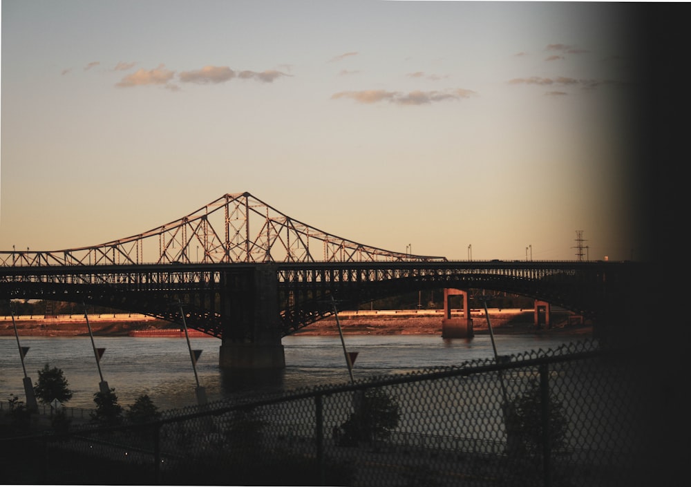 a view of a bridge over a body of water