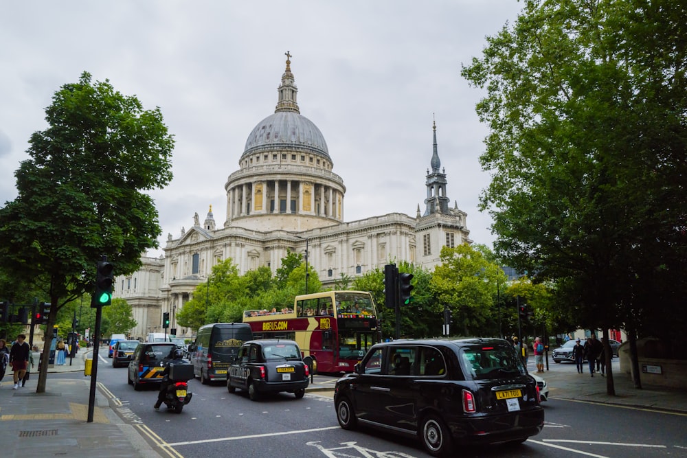 a busy city street with cars and buses