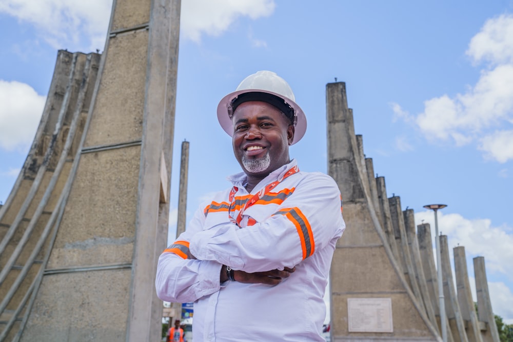 a man standing in front of a tall building