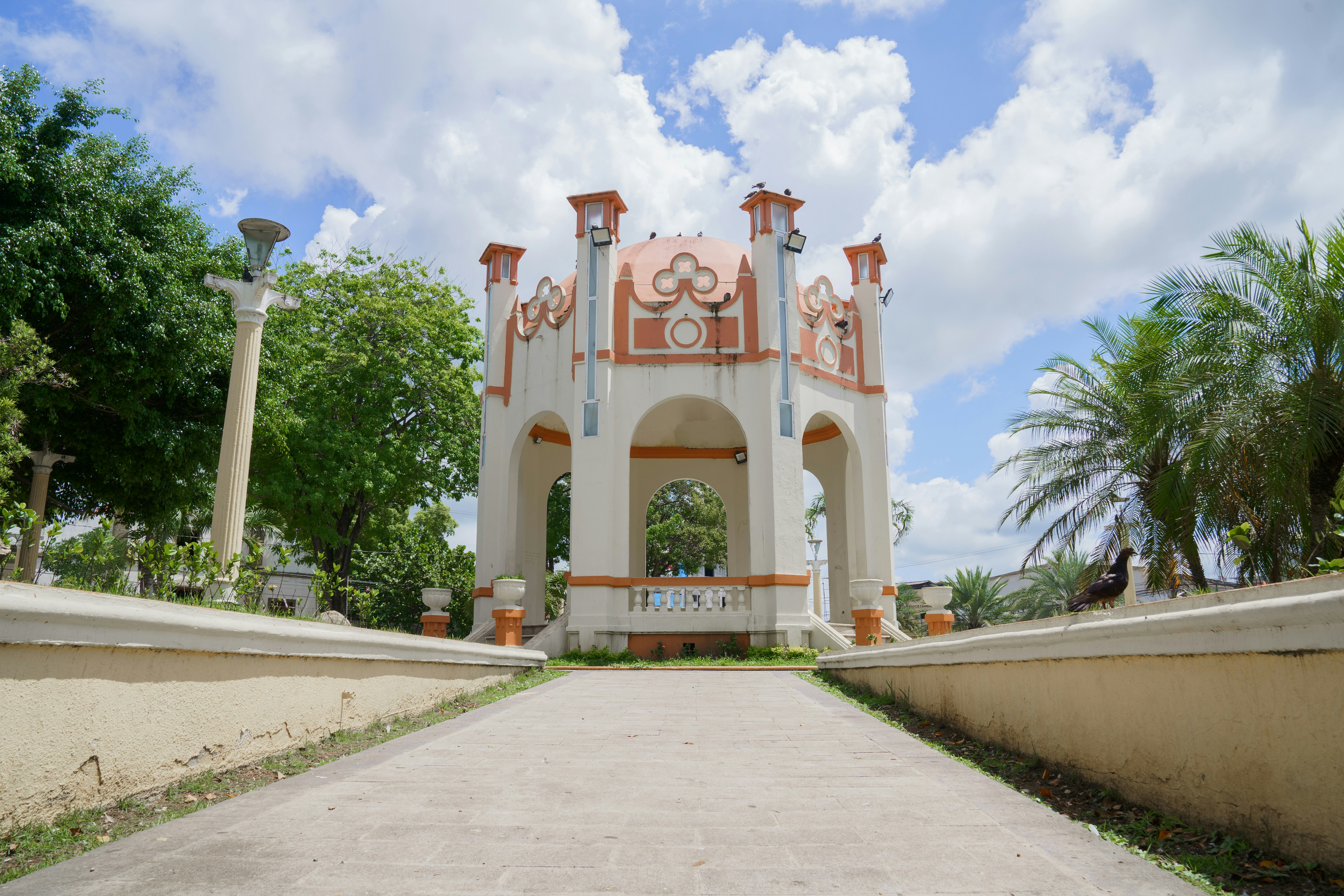 a large white building with a clock on it's side