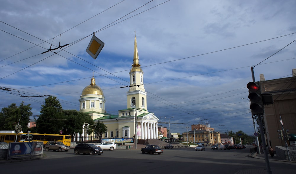 a city street with a church in the background