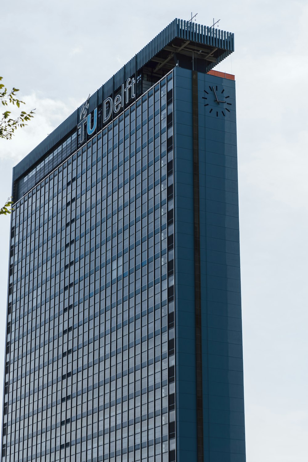 a tall building with a clock on the top of it