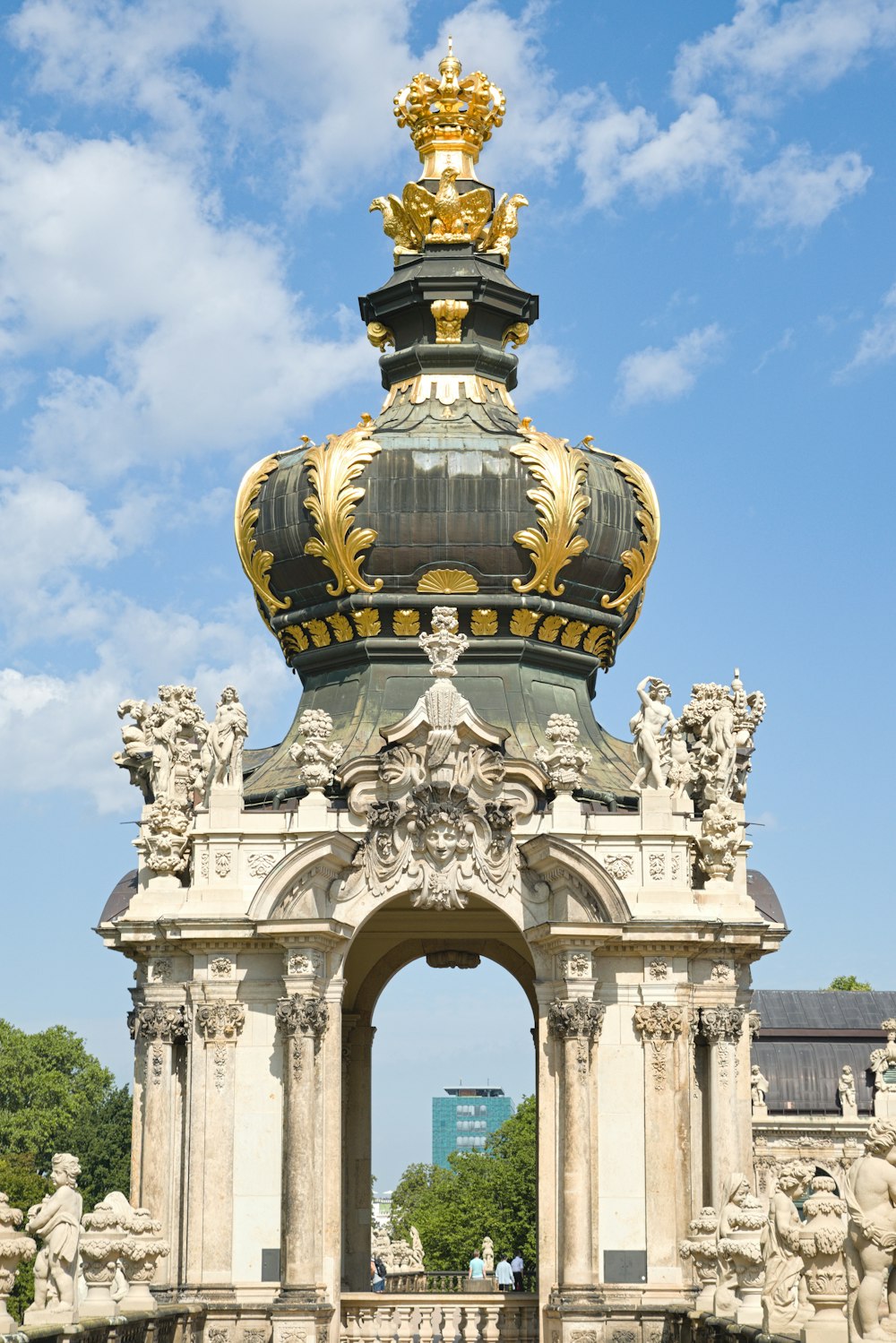 a statue with a gold crown on top of it