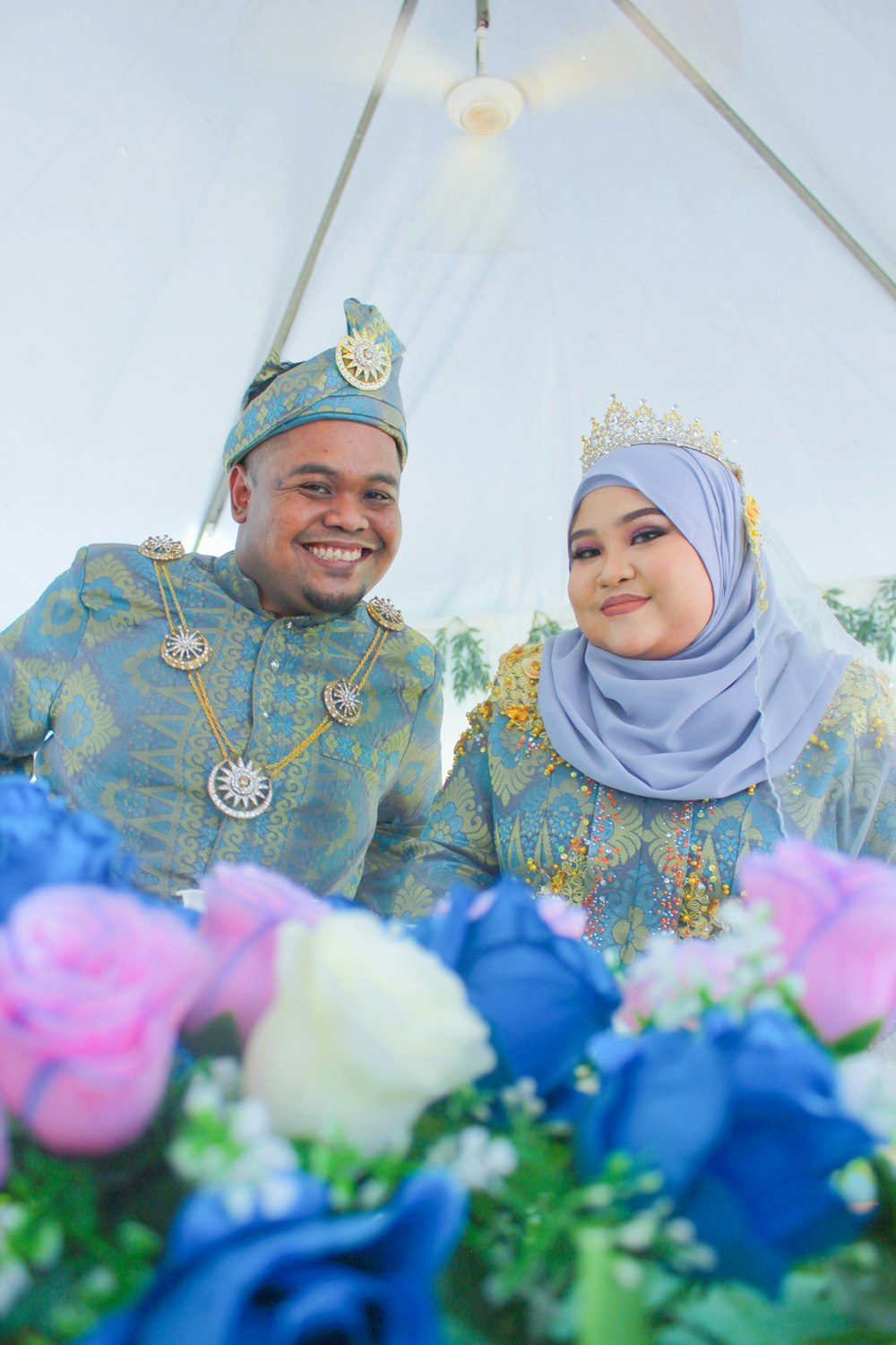 a man and a woman dressed in traditional clothing