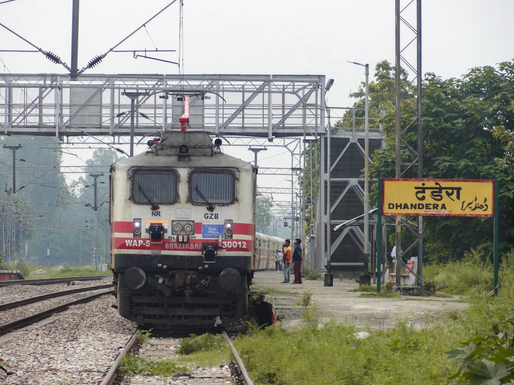 a train on a train track near a platform