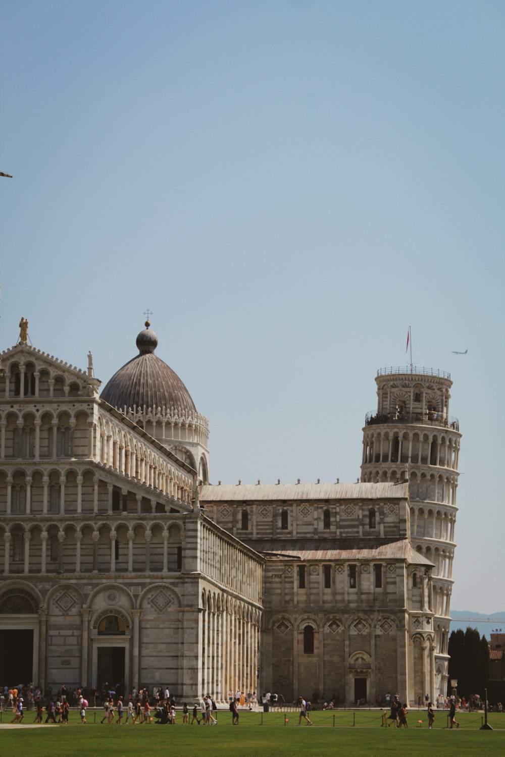 a group of people standing in front of a large building