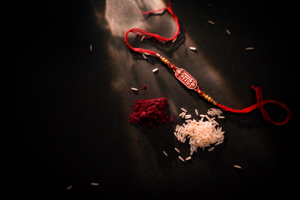 a close up of a red and white object on a table