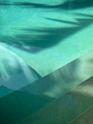a man riding a skateboard on top of a swimming pool