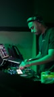 a dj mixing music in a dark room