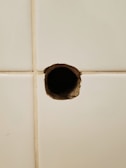 Close-up of a clean 90mm core drill hole made in a brick wall.