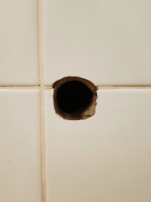 Close-up of a clean 90mm core drill hole made in a brick wall.