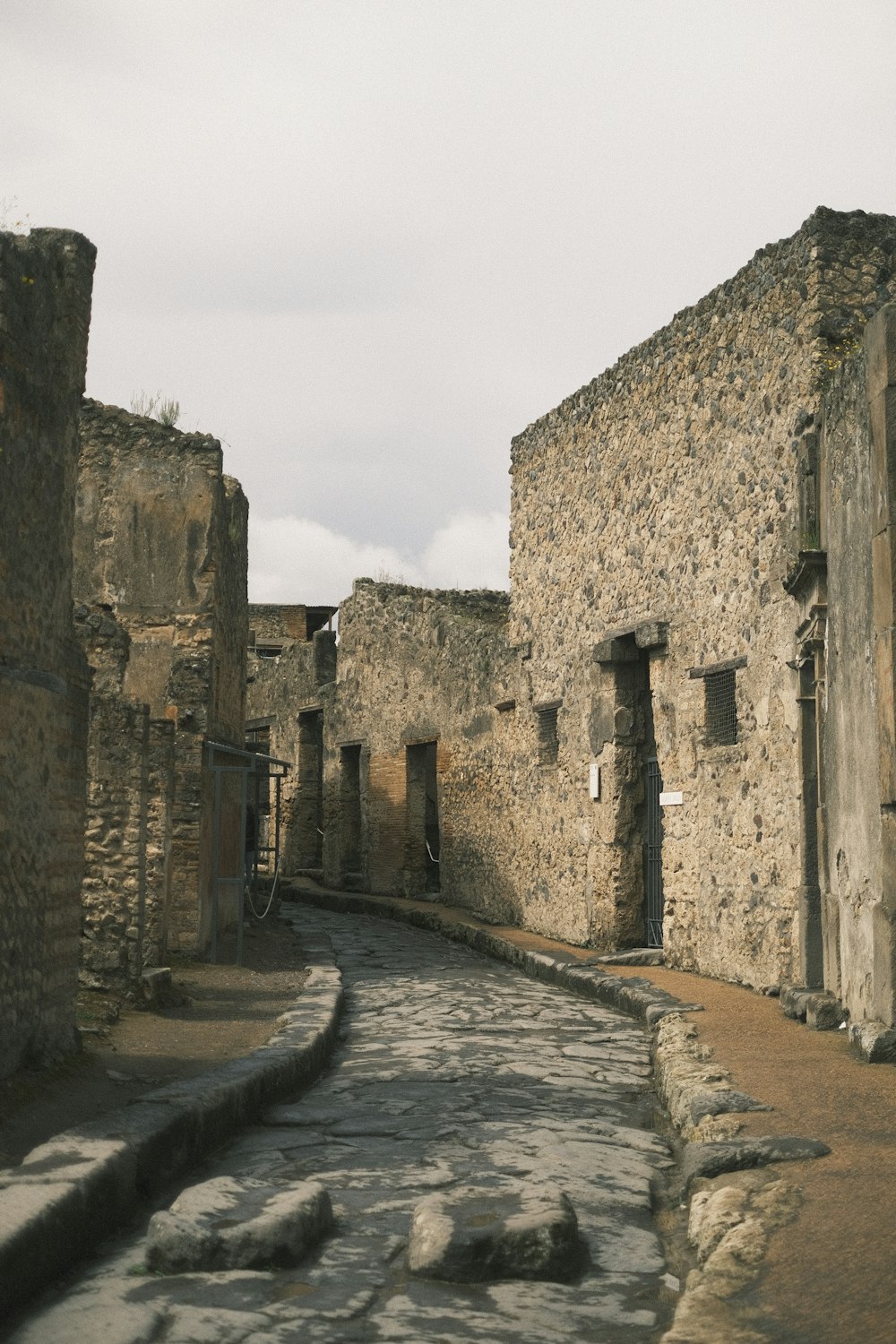 a cobblestone street lined with stone buildings