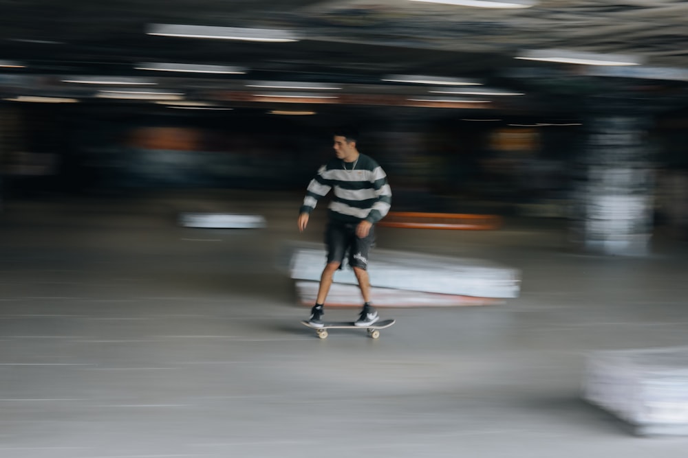a blurry photo of a man riding a skateboard