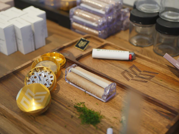 A colorful display of rolling papers and grinders neatly arranged in the shop