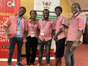 A group photo of the Acholiland Innovation Incubation Centre team at a local environmental event