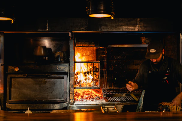 Chef preparing fresh Tuscan dishes in the open kitchen.