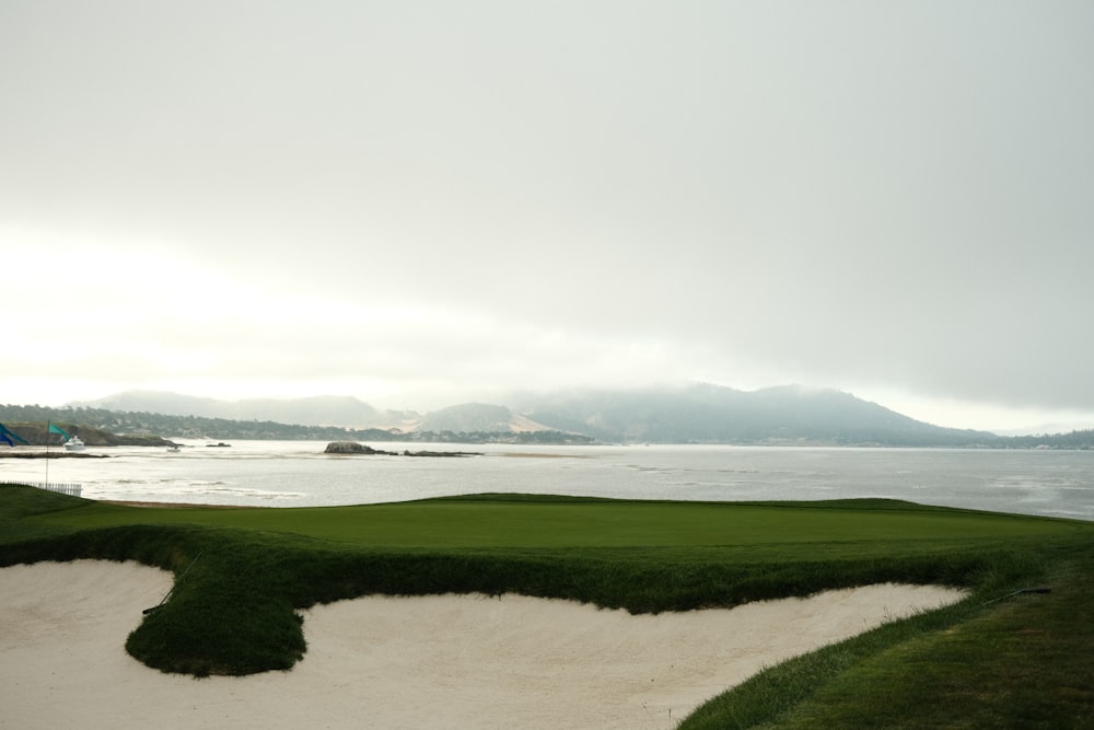 a golf course with a view of the ocean