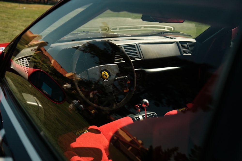 the interior of a car with a steering wheel