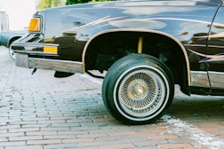 a black car parked on the side of the road