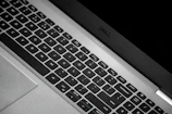 Close-up of a sleek laptop keyboard with the Nexumente logo subtly visible