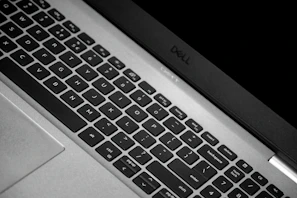 Close-up of a sleek laptop keyboard with the Nexumente logo subtly visible