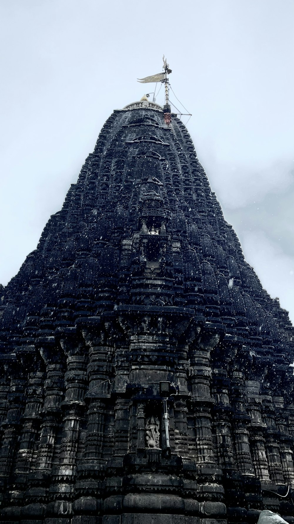 a very tall building with a sky background