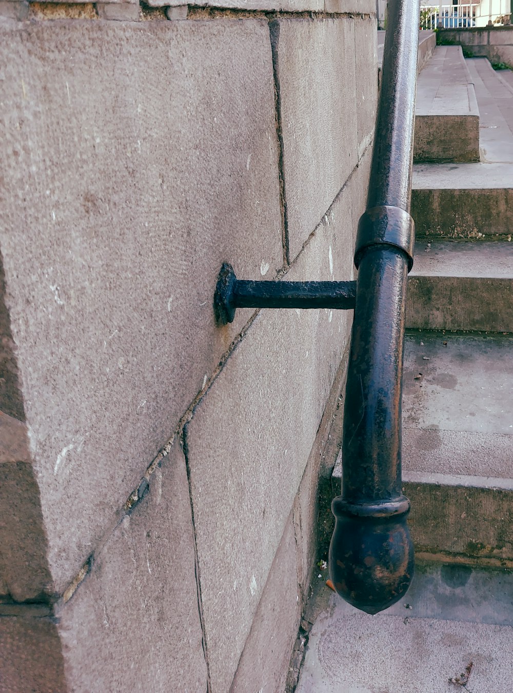 a metal pipe on the side of a building