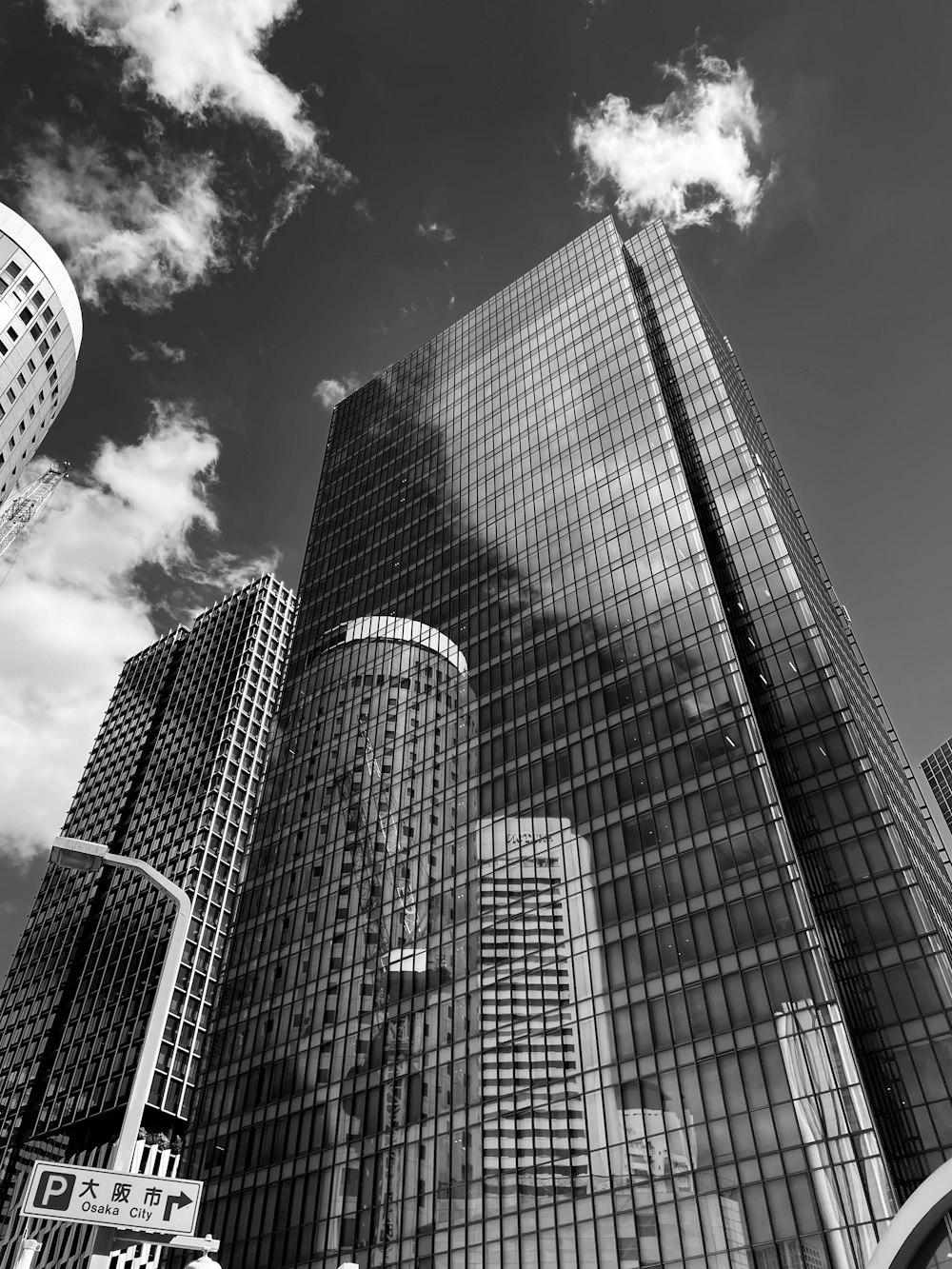 a black and white photo of skyscrapers in a city