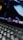 Close-up of hands typing on a laptop keyboard with cloud icons floating above.