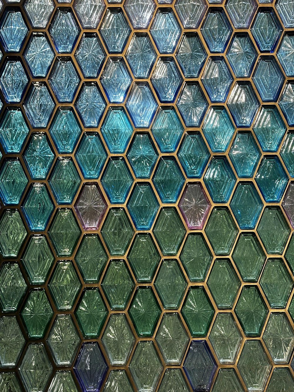 a close up of a glass window with a hexagonal pattern