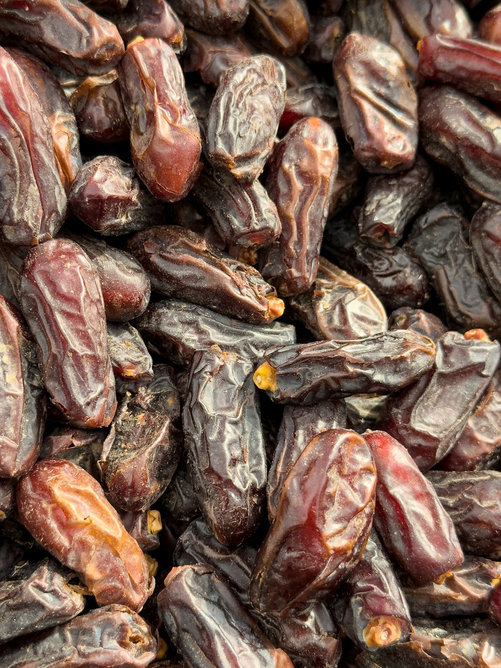 a pile of raisins sitting on top of a table