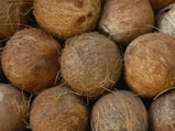 a pile of coconuts sitting on top of each other