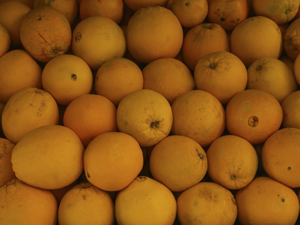 a pile of oranges sitting next to each other