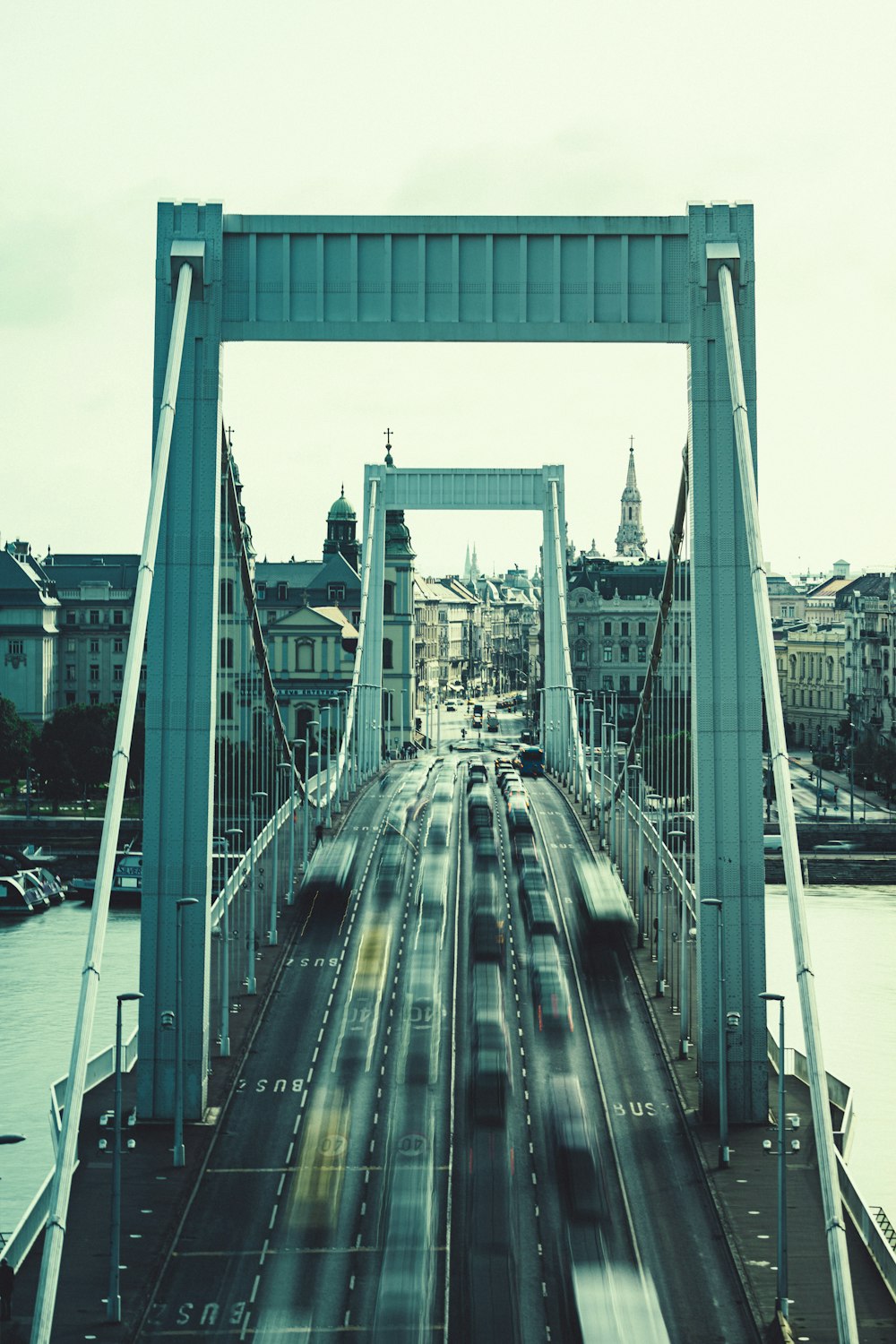 a view of a bridge with cars going over it