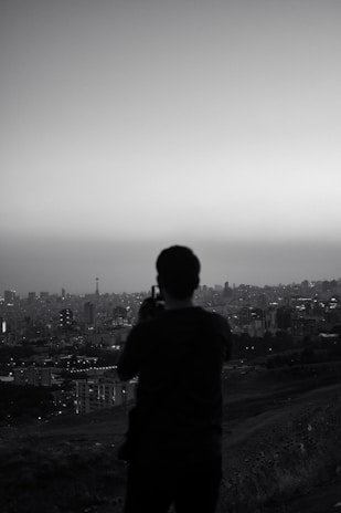 An artistic shot of a photographer capturing a cityscape.
