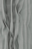 a black and white photo of a curtain